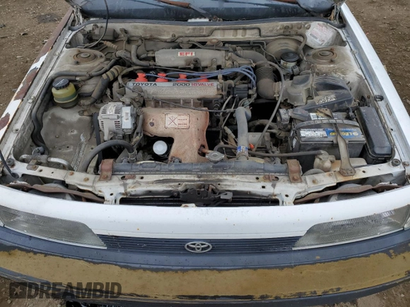 1991 Toyota Camry z VIN 4T1SV24E5MU355011, wystawiony jako Copart lot #51021185 z przebiegiem 135 881 mil mil oraz Czysty tytuł • Clean title. Historia ofert i sprzedaży dostępna na DreamBid. Obrazek 11.