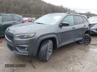 2022 Jeep Cherokee X with VIN 1C4PJMCX4ND525297, listed as a IAAI auction lot 41519912 with 42,691 mi miles. Bid and sale history available at carsss.com. Image 2.