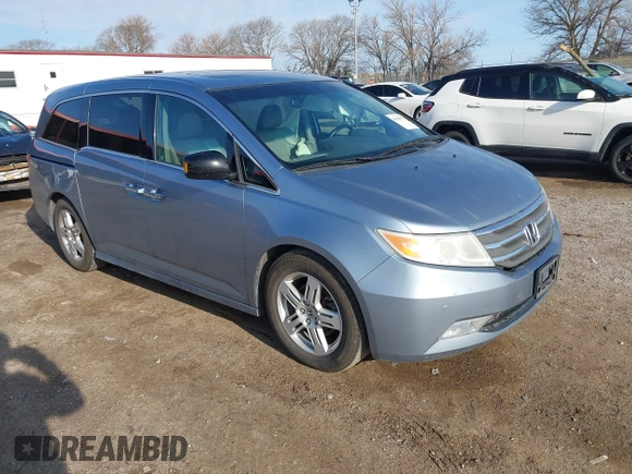 2011 Honda Odyssey Touring with VIN 5FNRL5H9XBB085626, listed as a IAAI auction lot 41890577 with 178,317 mi miles and . Bid and sale history available at DreamBid. Image 1.