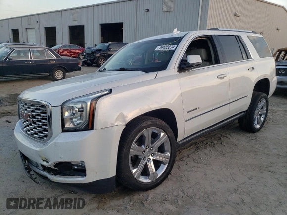 2019 GMC Yukon Denali with VIN 1GKS1CKJ9KR322958, listed as a Copart auction lot 79485874 with 86,512 mi miles and Salvage Title. Bid and sale history available at carsss.com. Image 1.