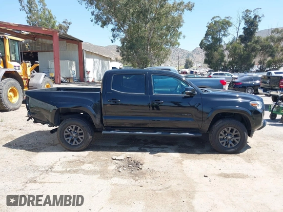 2023 Toyota Tacoma SR with VIN 3TMCZ5AN1PM654572, listed as a IAAI auction lot 42312575 with 14,111 mi miles and . Bid and sale history available at DreamBid. Image 13.