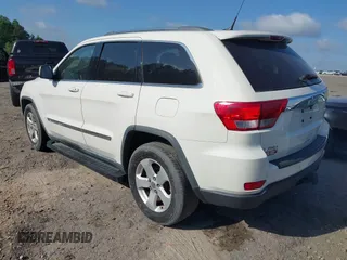 2011 Jeep Grand Cherokee Laredo with VIN 1J4RS4GGXBC517068, listed as a IAAI auction lot 42173780 with 170,688 mi miles and . Bid and sale history available at DreamBid. Image 3.