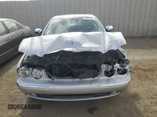 2004 Jaguar XJ with VIN SAJEA74C34SG09548, listed as a Copart auction lot 71754774 with 142,804 mi miles and Salvage Title. Bid and sale history available at DreamBid. Image 5.