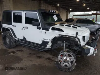2012 Jeep Wrangler Unlimited Sport z VIN 1C4BJWDG8CL183831, wystawiony jako IAAI lot #42343612 z przebiegiem 166 847 mil mil oraz . Historia ofert i sprzedaży dostępna na DreamBid. Obrazek 1.