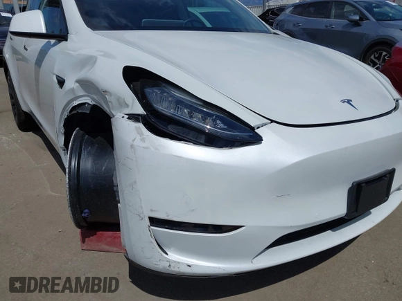 2020 Tesla Model Y Long Range with VIN 5YJYGDEE2LF058515, listed as a IAAI auction lot 41932748 with 62,885 mi miles and . Bid and sale history available at DreamBid. Image 20.