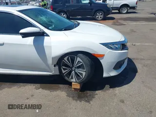 2016 Honda Civic EX-L z VIN 2HGFC1F83GH636374, wystawiony jako IAAI lot #42328432 z przebiegiem 130 738 mil mil oraz . Historia ofert i sprzedaży dostępna na DreamBid. Obrazek 6.