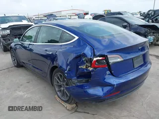 2019 Tesla Model 3 Mid Range with VIN 5YJ3E1EA5KF190453, listed as a IAAI auction lot 41880684 with 58,909 mi miles and . Bid and sale history available at carsss.com. Image 6.