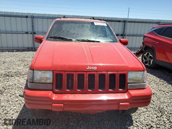 1997 Jeep Grand Cherokee Limited with VIN 1J4GZ78Y7VC573971, listed as a Copart auction lot 61358024 with 171,055 mi miles and Salvage Title. Bid and sale history available at carsss.com. Image 5.