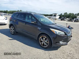 2013 Ford Escape Titanium z VIN 1FMCU0J93DUB60916, wystawiony jako Copart lot #61692595 z przebiegiem 169 691 mil mil oraz Szkoda całkowita • Salvage title. Historia ofert i sprzedaży dostępna na DreamBid. Obrazek 4.