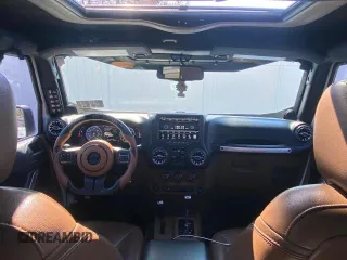 2014 Jeep Wrangler Unlimited Sahara with VIN 1C4BJWEG1EL272951, listed as a Copart auction lot 51147245 with 56,989 mi miles and Clean Title. Bid and sale history available at carsss.com. Image 9.