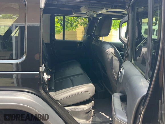 2023 Jeep Wrangler Sahara with VIN 1C4JJXP65PW627241, listed as a Copart auction lot 55661585 with 9,282 mi miles and Clean Title. Bid and sale history available at DreamBid. Image 6.