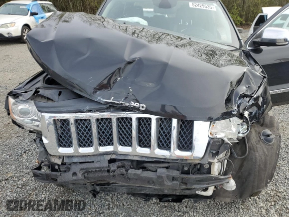 2013 Jeep Grand Cherokee Overland with VIN 1C4RJFCGXDC643802, listed as a Copart auction lot 52429535 with 122,014 mi miles and Salvage Title. Bid and sale history available at carsss.com. Image 13.
