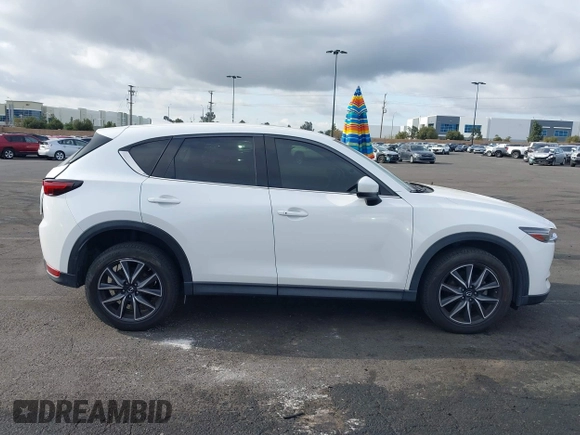 2018 Mazda CX-5 Grand Touring with VIN JM3KFADMXJ0470846, listed as a IAAI auction lot 41913533 with 54,700 mi miles and . Bid and sale history available at DreamBid. Image 14.