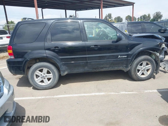 2006 Ford Escape Hybrid z VIN 1FMCU96H96KA25975, wystawiony jako IAAI lot #42130554 z przebiegiem 235 342 mil mil oraz . Historia ofert i sprzedaży dostępna na DreamBid. Obrazek 13.