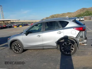 2016 Mazda CX-5 Grand Touring z VIN JM3KE2DY8G0709573, wystawiony jako IAAI lot #42021005 z przebiegiem 113 941 mil mil oraz . Historia ofert i sprzedaży dostępna na DreamBid. Obrazek 15.