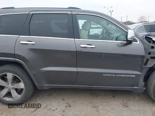 2014 Jeep Grand Cherokee Overland with VIN 1C4RJECG5EC207211, listed as a IAAI auction lot 41586309 with 115,293 mi miles. Bid and sale history available at carsss.com. Image 14.