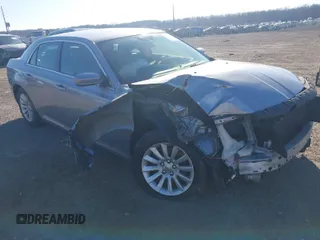 2013 Chrysler 300 Motown with VIN 2C3CCAAG0DH633741, listed as a IAAI auction lot 41702698 with 114,917 mi miles. Bid and sale history available at carsss.com. Image 1.