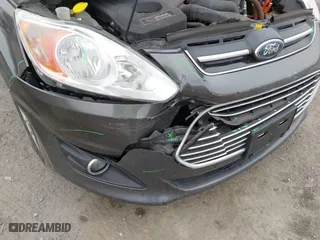 2015 Ford C-Max Energi SEL with VIN 1FADP5CU7FL121209, listed as a IAAI auction lot 41621034 with 145,648 mi miles. Bid and sale history available at carsss.com. Image 6.