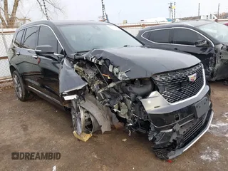 2021 Cadillac XT6 Premium Luxury z VIN 1GYKPDRS9MZ120150, wystawiony jako IAAI lot #41715368 z przebiegiem 47 835 mil mil oraz . Historia ofert i sprzedaży dostępna na DreamBid. Obrazek 1.