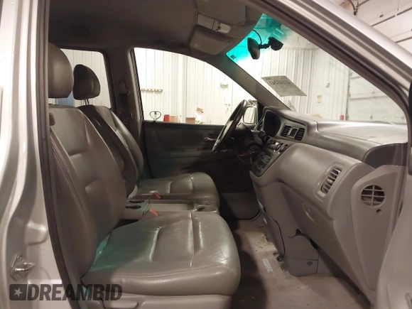 2004 Honda Odyssey EX-L with VIN 5FNRL18974B127696, listed as a IAAI auction lot 41643243 with 200,286 mi miles and . Bid and sale history available at DreamBid. Image 5.