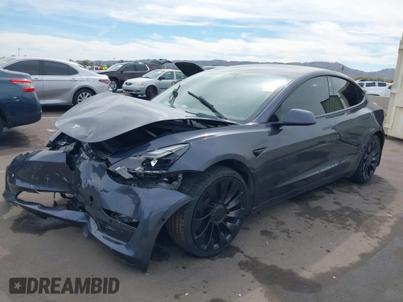 2022 Tesla Model 3 Performance with VIN 5YJ3E1EC3NF296891, listed as a IAAI auction lot 41808329 with 82,682 mi miles and . Bid and sale history available at DreamBid. Image 2.
