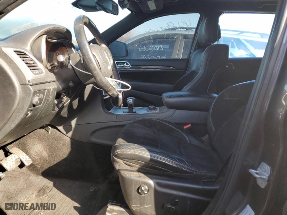 2015 Jeep Grand Cherokee SRT with VIN 1C4RJFDJ8FC752210, listed as a Copart auction lot 45694094 with 76,721 mi miles and Salvage Title. Bid and sale history available at carsss.com. Image 7.
