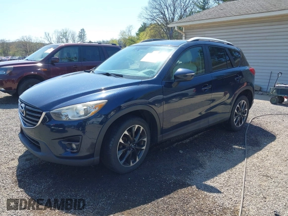 2016 Mazda CX-5 Grand Touring with VIN JM3KE4DY5G0681369, listed as a IAAI auction lot 42102805 with 128,182 mi miles and . Bid and sale history available at DreamBid. Image 18.
