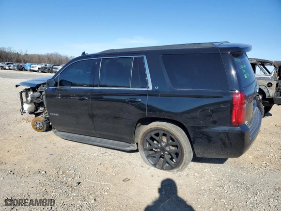 2019 Chevrolet Tahoe LT with VIN 1GNSCBKC5KR353908, listed as a Copart auction lot 41826985 with 97,949 mi miles and Clean Title. Bid and sale history available at carsss.com. Image 2.