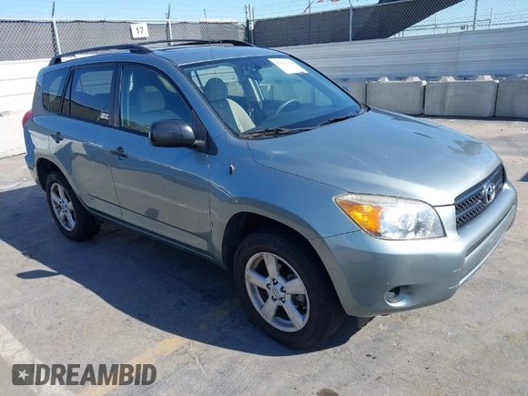 2006 Toyota RAV4 with VIN JTMZD33V465012121, listed as a IAAI auction lot 42013354 with 214,726 mi miles. Bid and sale history available at carsss.com. Image 1.