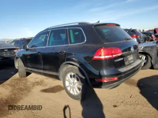 2014 Volkswagen Touareg Lux z VIN WVGEF9BP5ED003068, wystawiony jako Copart lot #82907984 z przebiegiem 127 347 mil mil oraz Czysty tytuł • Clean title. Historia ofert i sprzedaży dostępna na DreamBid. Obrazek 2.