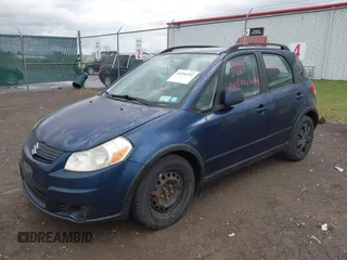 2010 Suzuki SX4 with VIN JS2YB5A37A6300142, listed as a IAAI auction lot 41956392 with 91,808 mi miles and . Bid and sale history available at DreamBid. Image 2.