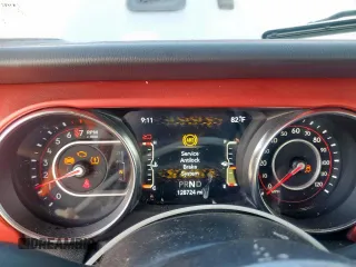 2021 Jeep Wrangler Unlimited Rubicon with VIN 1C4HJXFG0MW616829, listed as a Copart auction lot 61041425 with 128,724 mi miles and Salvage title. Bid and sale history available at DreamBid. Image 9.