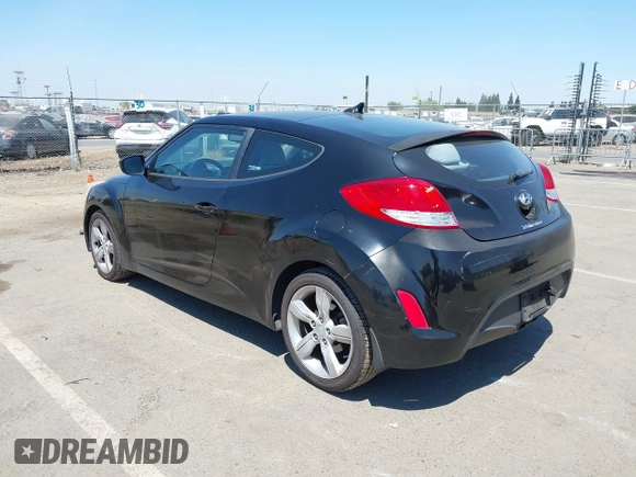 2013 Hyundai Veloster w/Black Int with VIN KMHTC6AD2DU144376, listed as a IAAI auction lot 42720882 with 143,023 mi miles and . Bid and sale history available at DreamBid. Image 3.