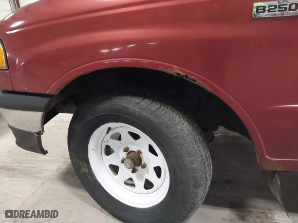 1999 Mazda B-Series 2WD Truck SX with VIN 4F4YR12C8XTM08476, listed as a IAAI auction lot 41864144 with NaN miles. Bid and sale history available at carsss.com. Image 12.