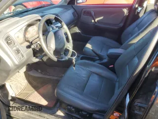 1999 Infiniti G20 z VIN JNKCP11A6XT003028, wystawiony jako Copart lot #72412504 z przebiegiem 157 279 mil mil oraz Szkody całkowita. Historia ofert i sprzedaży dostępna na DreamBid. Obrazek 7.