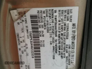 2004 Ford Taurus SE z VIN 1FAFP53U44A122559, wystawiony jako Copart lot #55606595 z przebiegiem Nie podano mil oraz Szkoda całkowita • Salvage title. Historia ofert i sprzedaży dostępna na DreamBid. Obrazek 12.