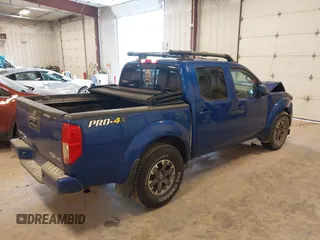 2015 Nissan Frontier SV with VIN 1N6AD0EV4FN709892, listed as a IAAI auction lot 42473594 with 153,103 mi miles and . Bid and sale history available at DreamBid. Image 4.