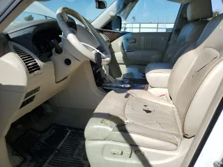 2012 Infiniti QX56 7-passenger with VIN JN8AZ2NE1C9017744, listed as a Copart auction lot 52988725 with 142,820 mi miles and Salvage title. Bid and sale history available at DreamBid. Image 7.