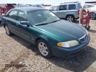 2001 Mazda 626 LX with VIN 1YVGF22D915241384, listed as a IAAI auction lot 41927705 with 231,801 mi miles. Bid and sale history available at carsss.com. Image 1.