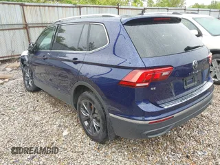 2022 Volkswagen Tiguan SE with VIN 3VV2B7AX8NM098143, listed as a IAAI auction lot 42209345 with 32,891 mi miles and . Bid and sale history available at DreamBid. Image 3.