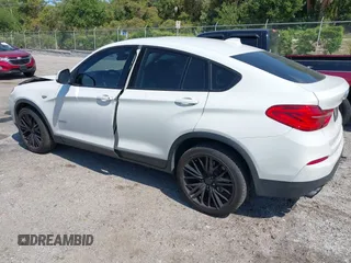2015 BMW X4 xDrive28i with VIN 5UXXW3C59F0M88331, listed as a IAAI auction lot 42093953 with 138,205 mi miles and . Bid and sale history available at DreamBid. Image 3.