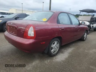 1999 Daewoo Nubira CDX z VIN KLAJB52Z5XK256700, wystawiony jako Copart lot #75085934 z przebiegiem Nie podano mil oraz Szkody całkowita. Historia ofert i sprzedaży dostępna na DreamBid. Obrazek 3.