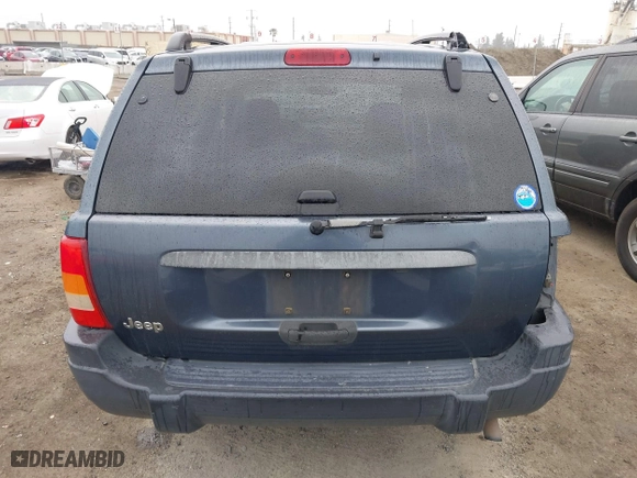2004 Jeep Grand Cherokee Laredo with VIN 1J4GX48S64C291075, listed as a IAAI auction lot 41805747 with 282,384 mi miles. Bid and sale history available at carsss.com. Image 16.