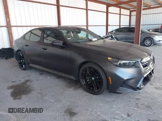 2025 BMW 5 Series with VIN WBS83FK04SCU11874, listed as a IAAI auction lot 42543784 with 4,517 mi miles and . Bid and sale history available at DreamBid. Image 1.