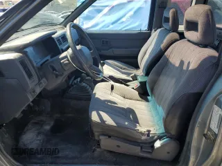 1993 Nissan Frontier SE with VIN 1N6HD16Y9PC430786, listed as a Copart auction lot 56333545 with 262,505 mi miles and Salvage title. Bid and sale history available at DreamBid. Image 7.