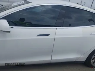 2014 Tesla Model S 60 with VIN 5YJSA1H16EFP32585, listed as a IAAI auction lot 42068925 with 119,561 mi miles and . Bid and sale history available at DreamBid. Image 14.