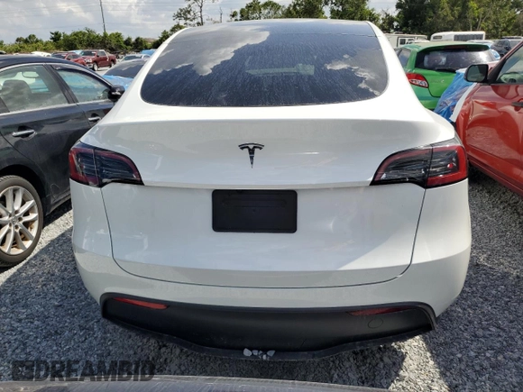 2025 Tesla Model Y Long Range with VIN 7SAYGDED4SF232433, listed as a Copart auction lot 51504015 with Not Provided miles and Salvage Title. Bid and sale history available at DreamBid. Image 6.