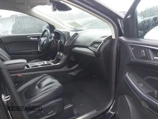 2021 Ford Edge Titanium z VIN 2FMPK3K99MBA16882, wystawiony jako IAAI lot #42214606 z przebiegiem 140 031 mil mil oraz . Historia ofert i sprzedaży dostępna na DreamBid. Obrazek 5.