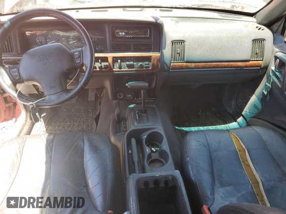 1997 Jeep Grand Cherokee Limited with VIN 1J4GZ78Y7VC573971, listed as a Copart auction lot 61358024 with 171,055 mi miles and Salvage Title. Bid and sale history available at carsss.com. Image 8.