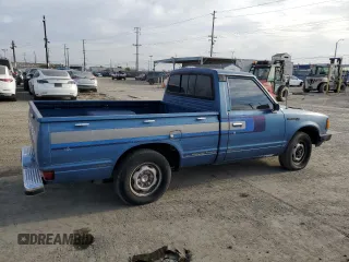 1982 Datsun 720 z VIN JN6SD01SXCW102918, wystawiony jako Copart lot #51125715 z przebiegiem 226 428 mil mil oraz Tytuł czysty. Historia ofert i sprzedaży dostępna na DreamBid. Obrazek 3.